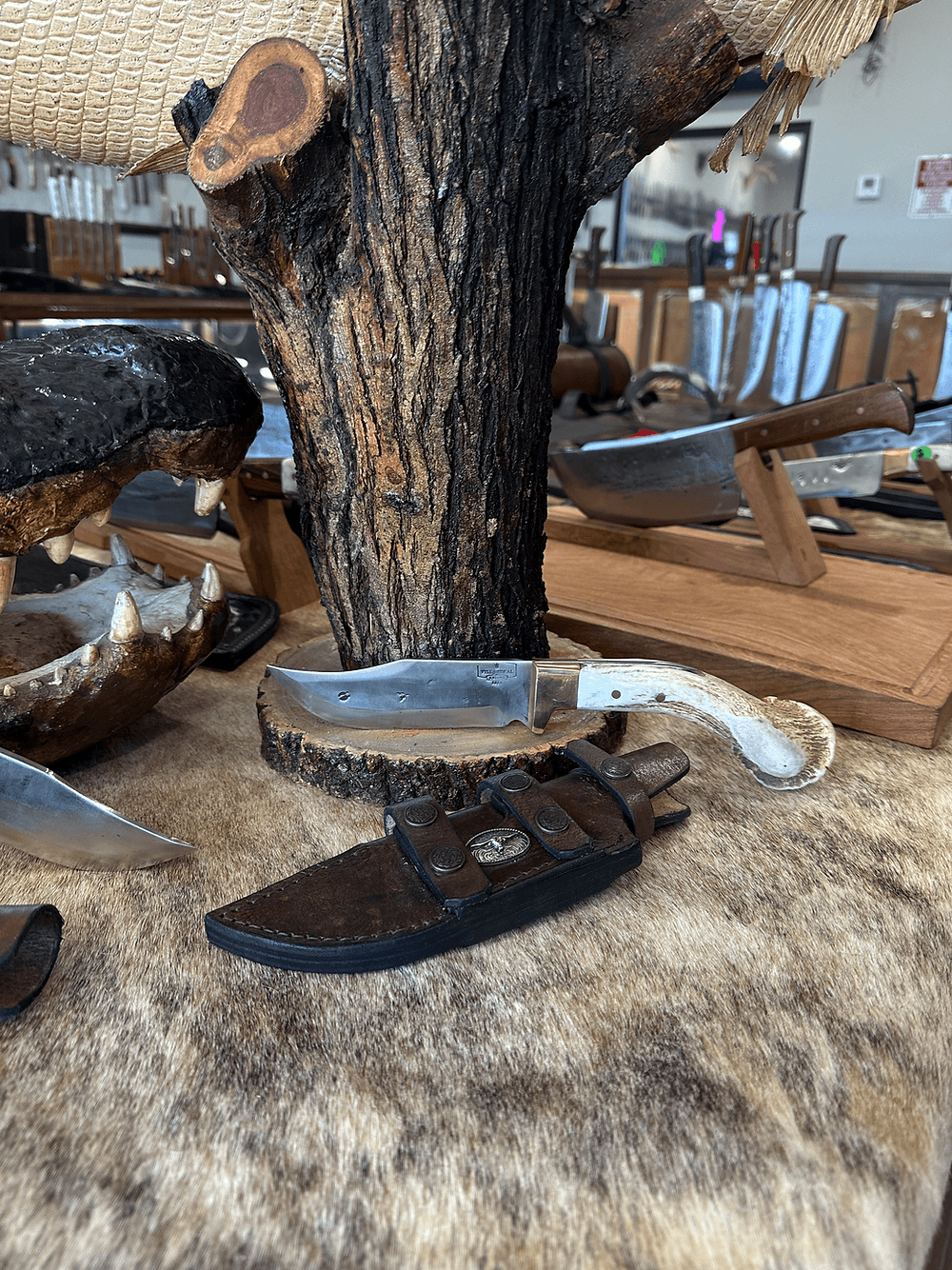 A hand-forged hunter knife on display inside the Villarreal Knives Edinburg storefront